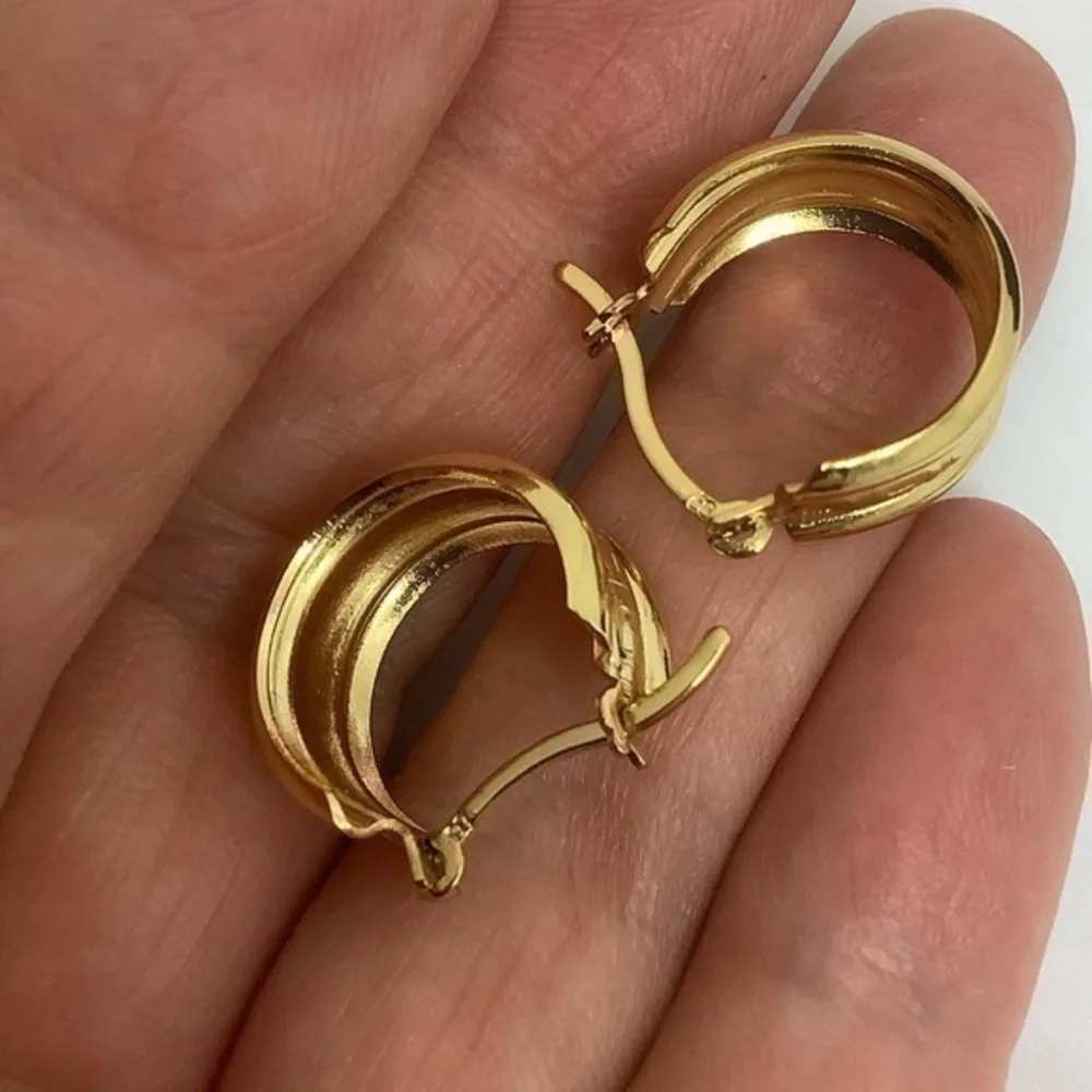 - Gold over sterling silver huggie earrings